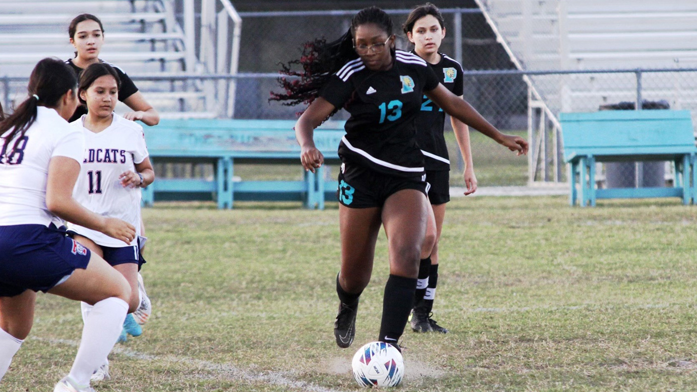 Deirdra Milord playing soccer